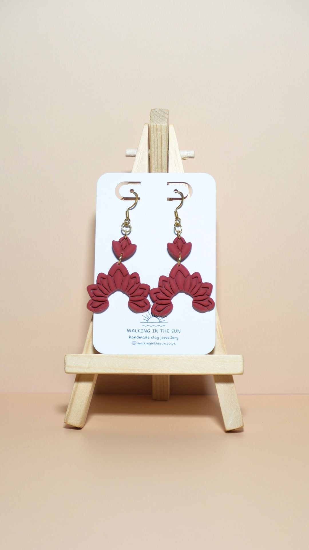 Handmade floral dangle polymer clay earrings in strawberry red
