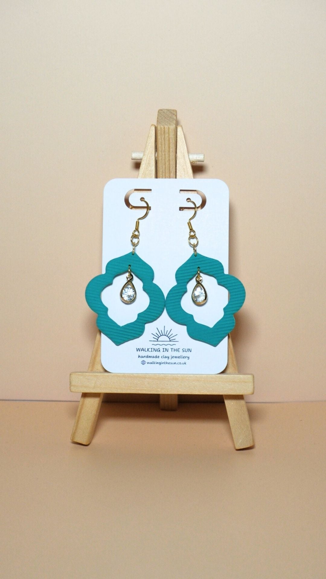 Handmade crystal drop frame polymer clay earrings in sea blue