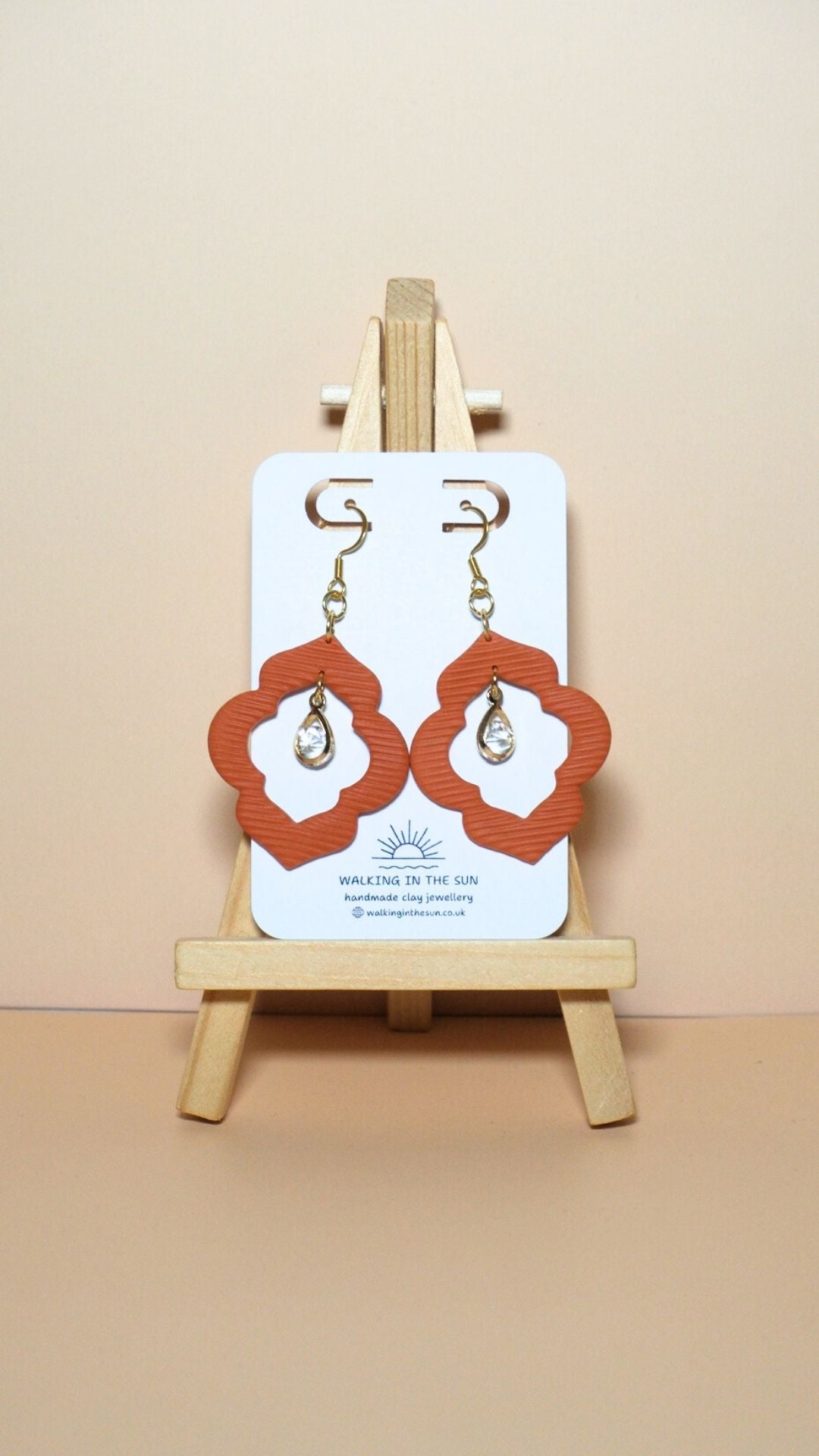 Handmade crystal drop frame polymer clay earrings in sunny orange