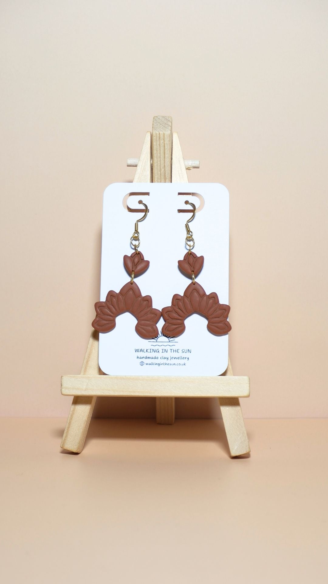 Handmade floral dangle polymer clay earrings in burnt orange
