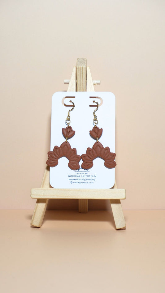 Handmade floral dangle polymer clay earrings in burnt orange