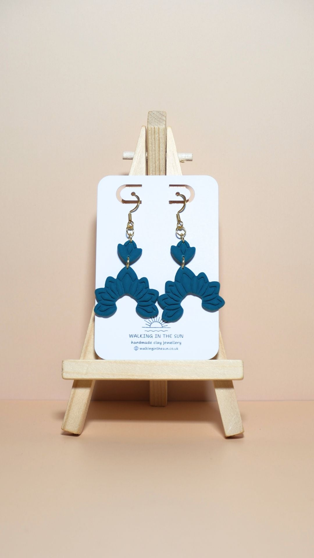 Handmade floral dangle polymer clay earrings in ice blue