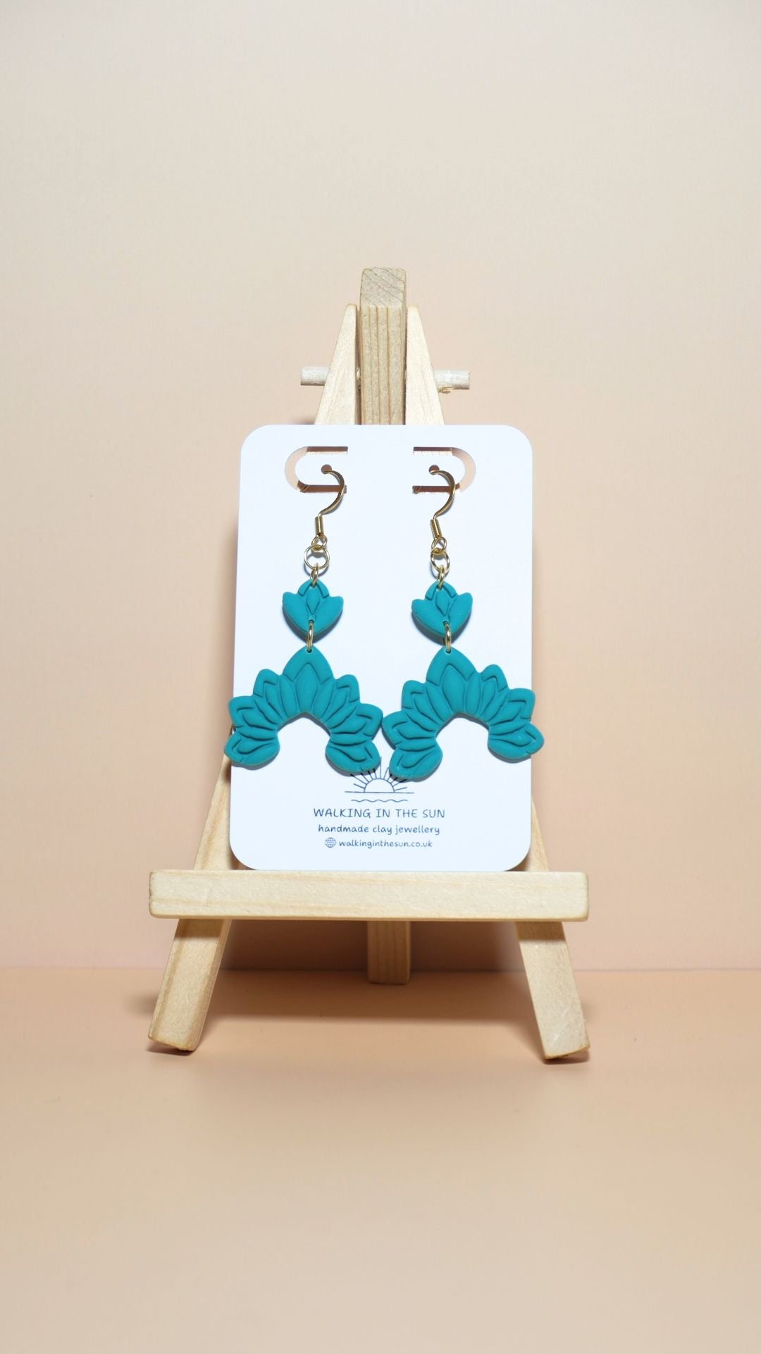 Handmade floral dangle polymer clay earrings in sea blue