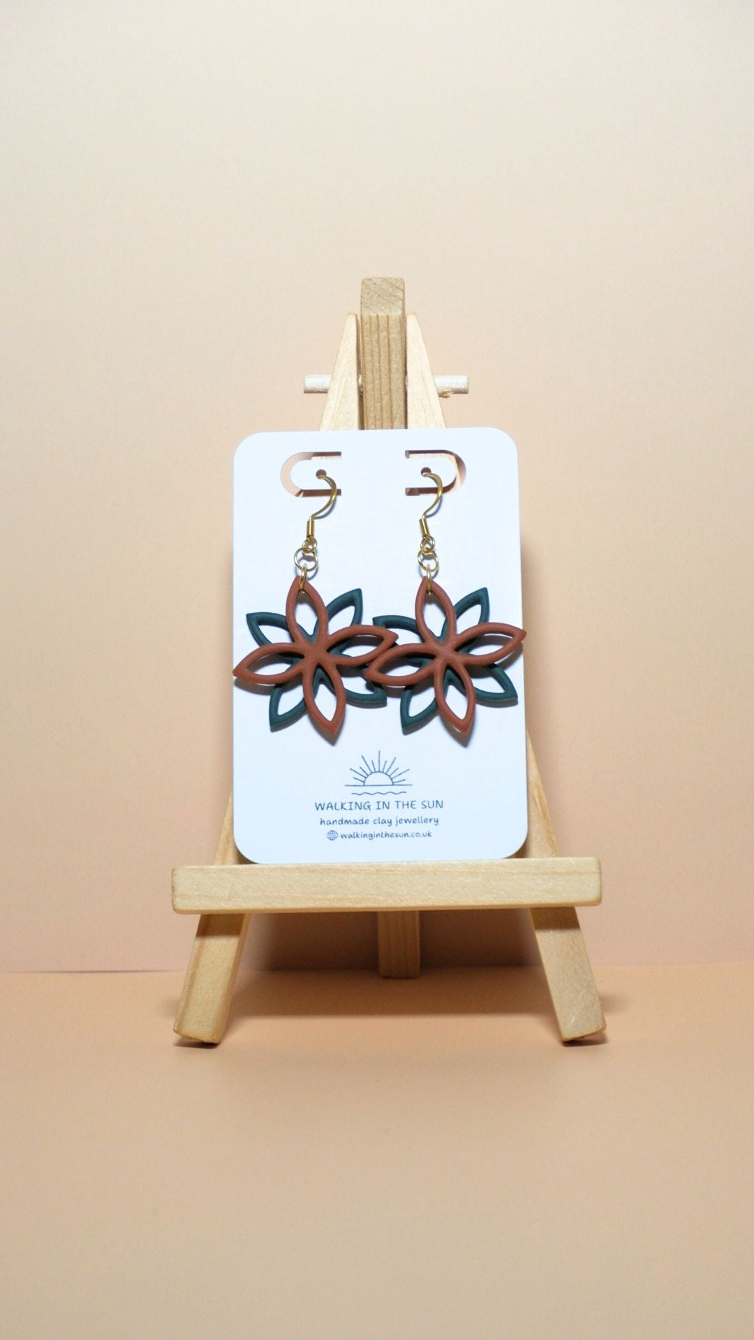 Handmade floral overlap polymer clay earrings in burnt orange and forest green