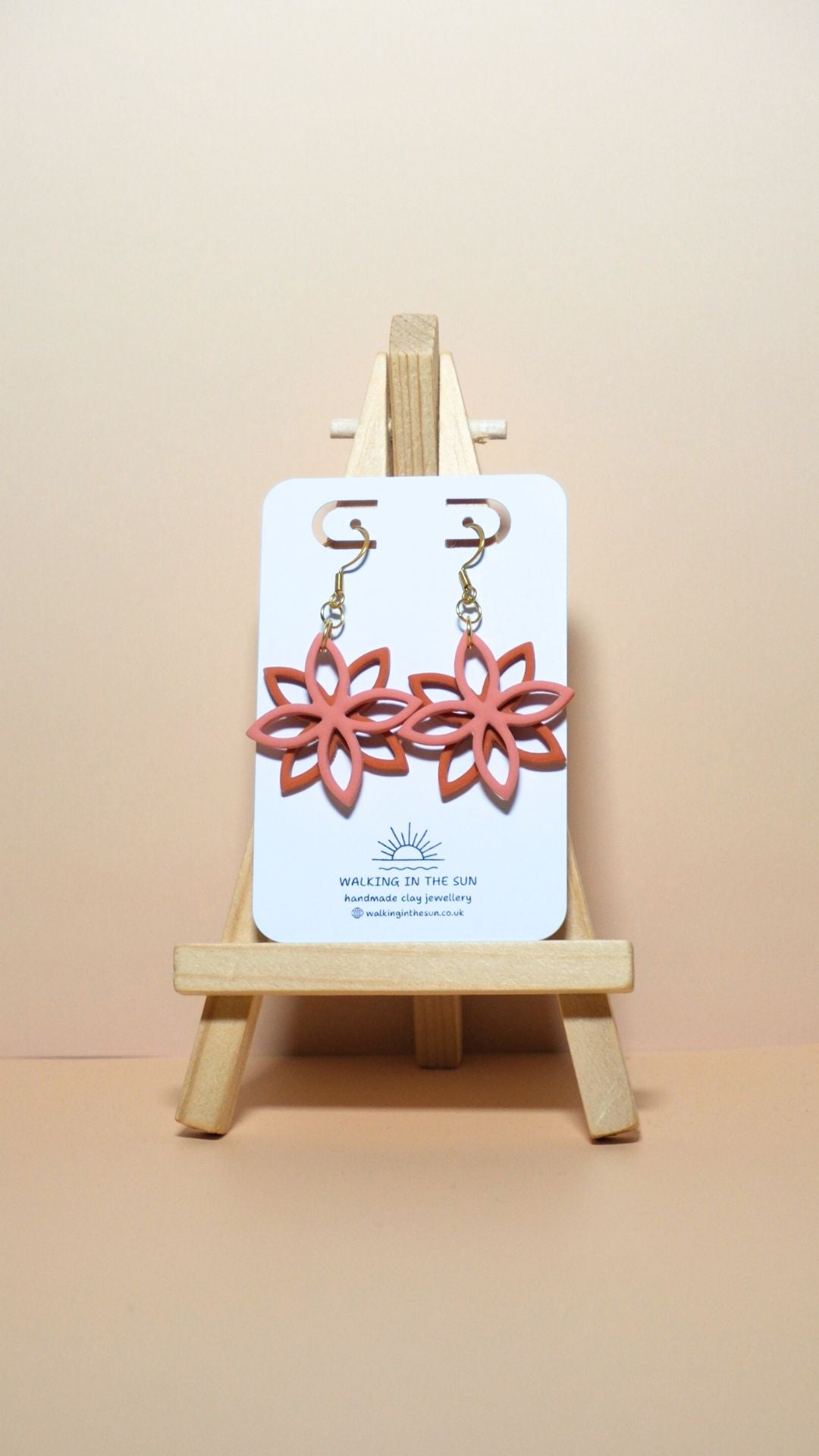 Handmade floral overlap polymer clay earrings in coral pink and sunny orange