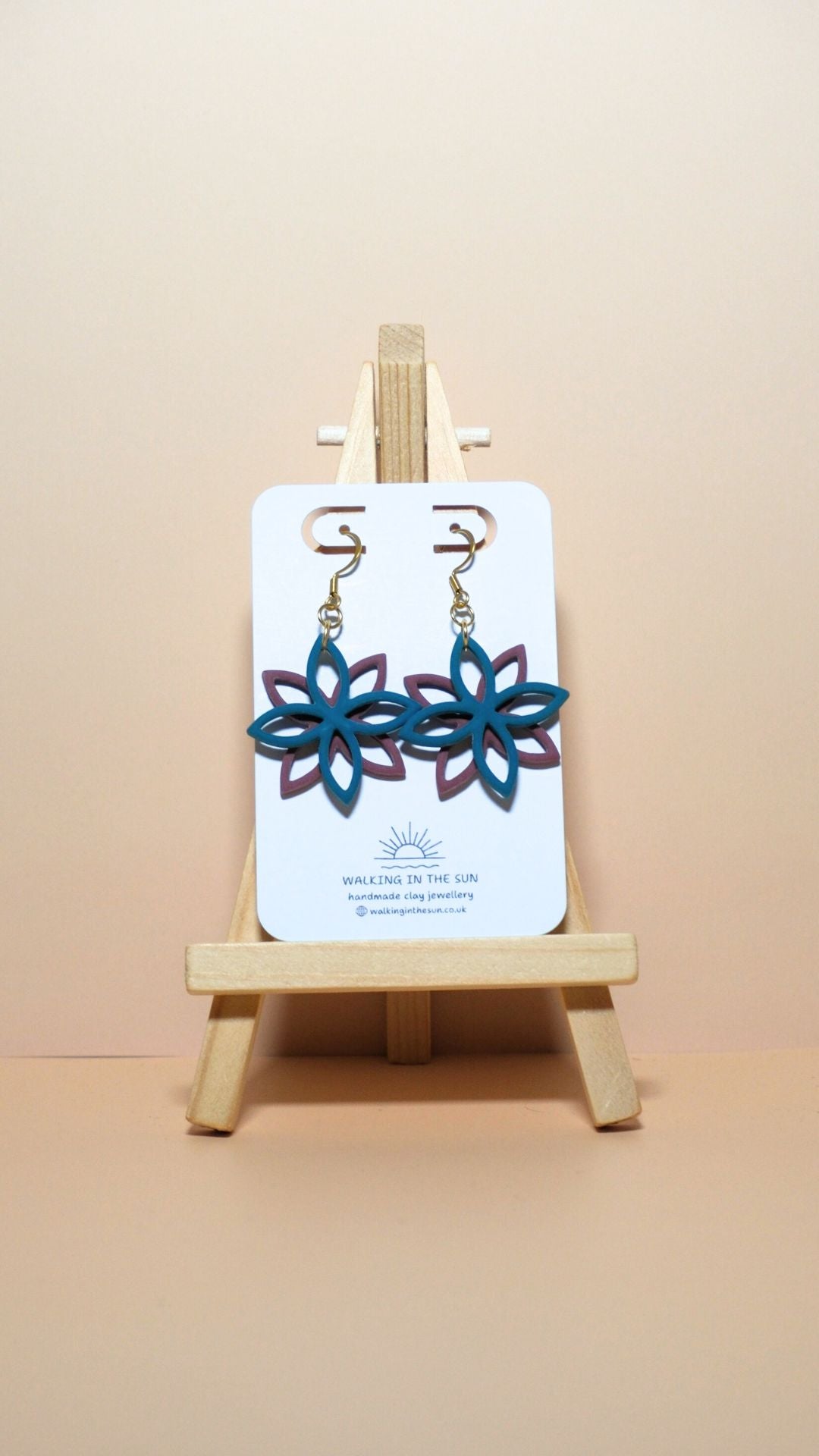 Handmade floral overlap polymer clay earrings in ice blue and berry red