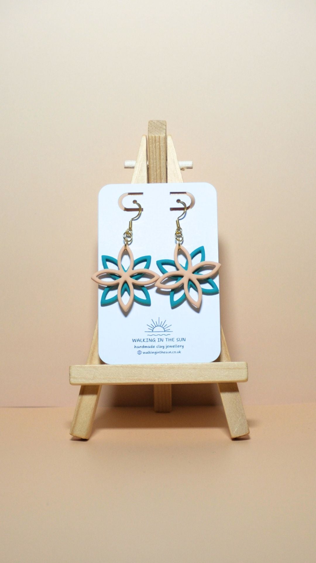 Handmade floral overlap polymer clay earrings in sandy beige and sea blue