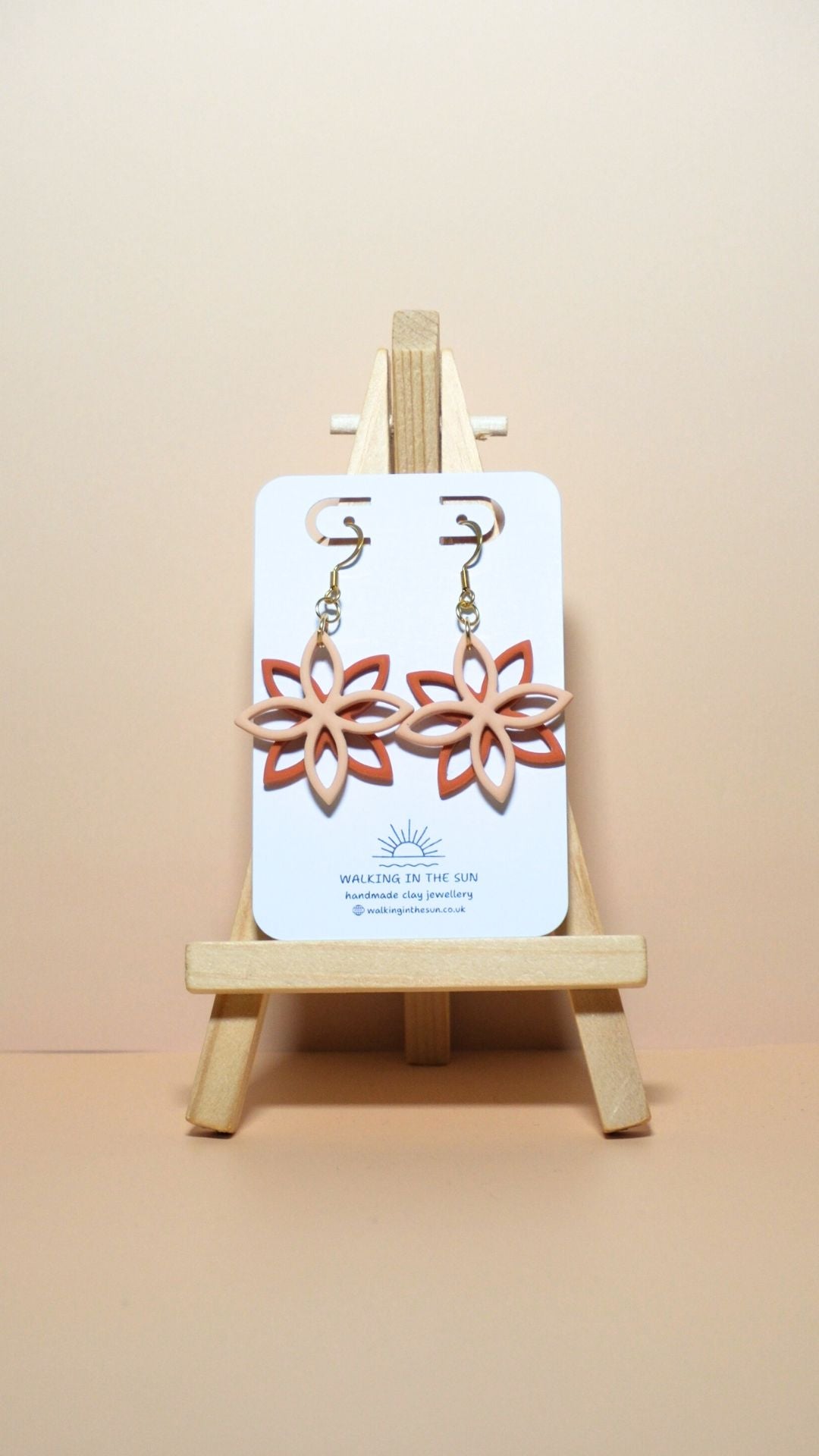 Handmade floral overlap polymer clay earrings in sandy beige and sunny orange