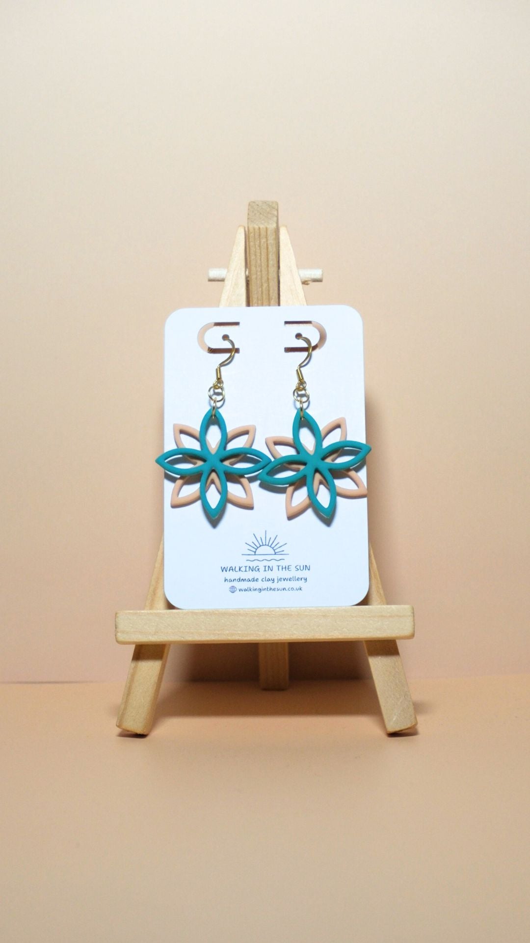Handmade floral overlap polymer clay earrings in sea blue and sandy beige