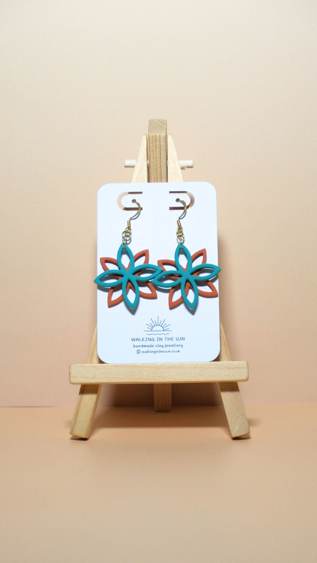 Handmade floral overlap polymer clay earrings in sea blue and sunny orange