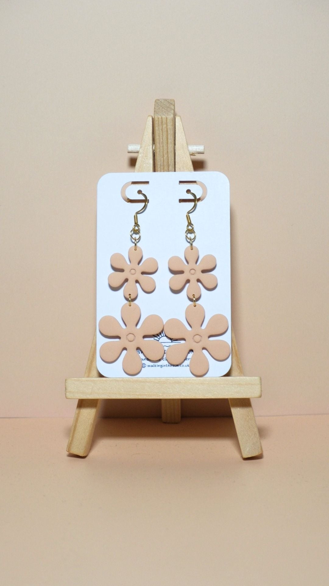 Handmade flower stack polymer clay earrings in sandy beige