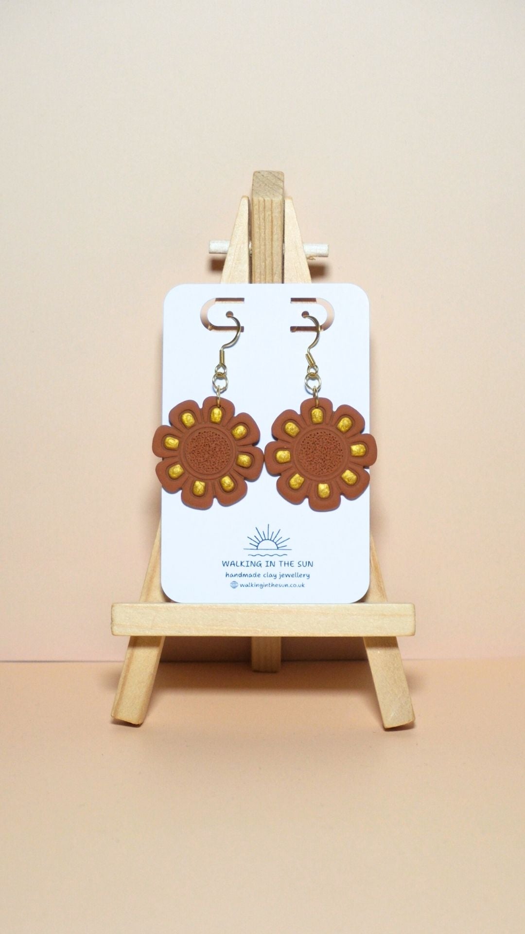 Handmade flower with gold detailing polymer clay earrings in burnt orange