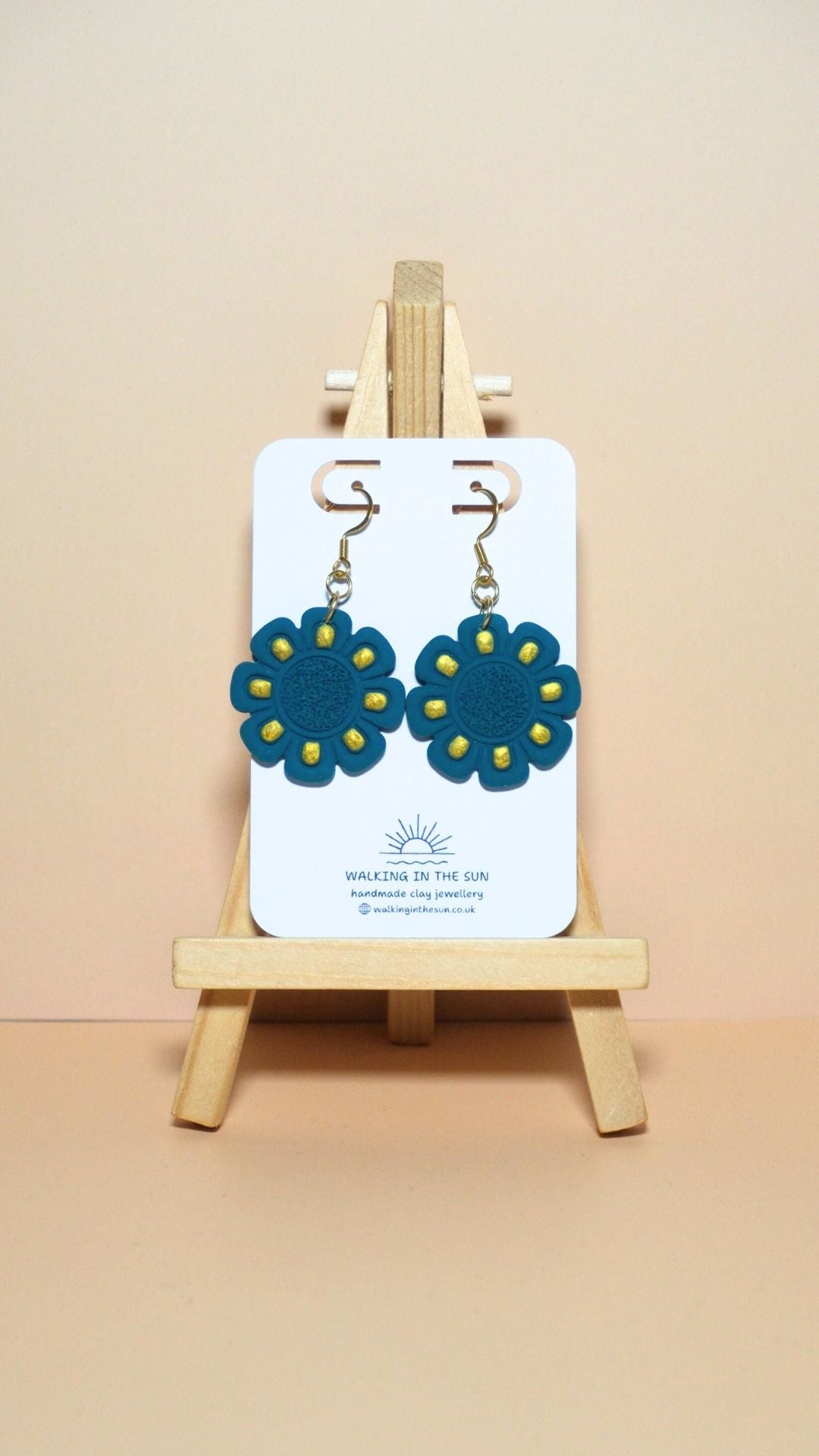 Handmade flower with gold detailing polymer clay earrings in ice blue