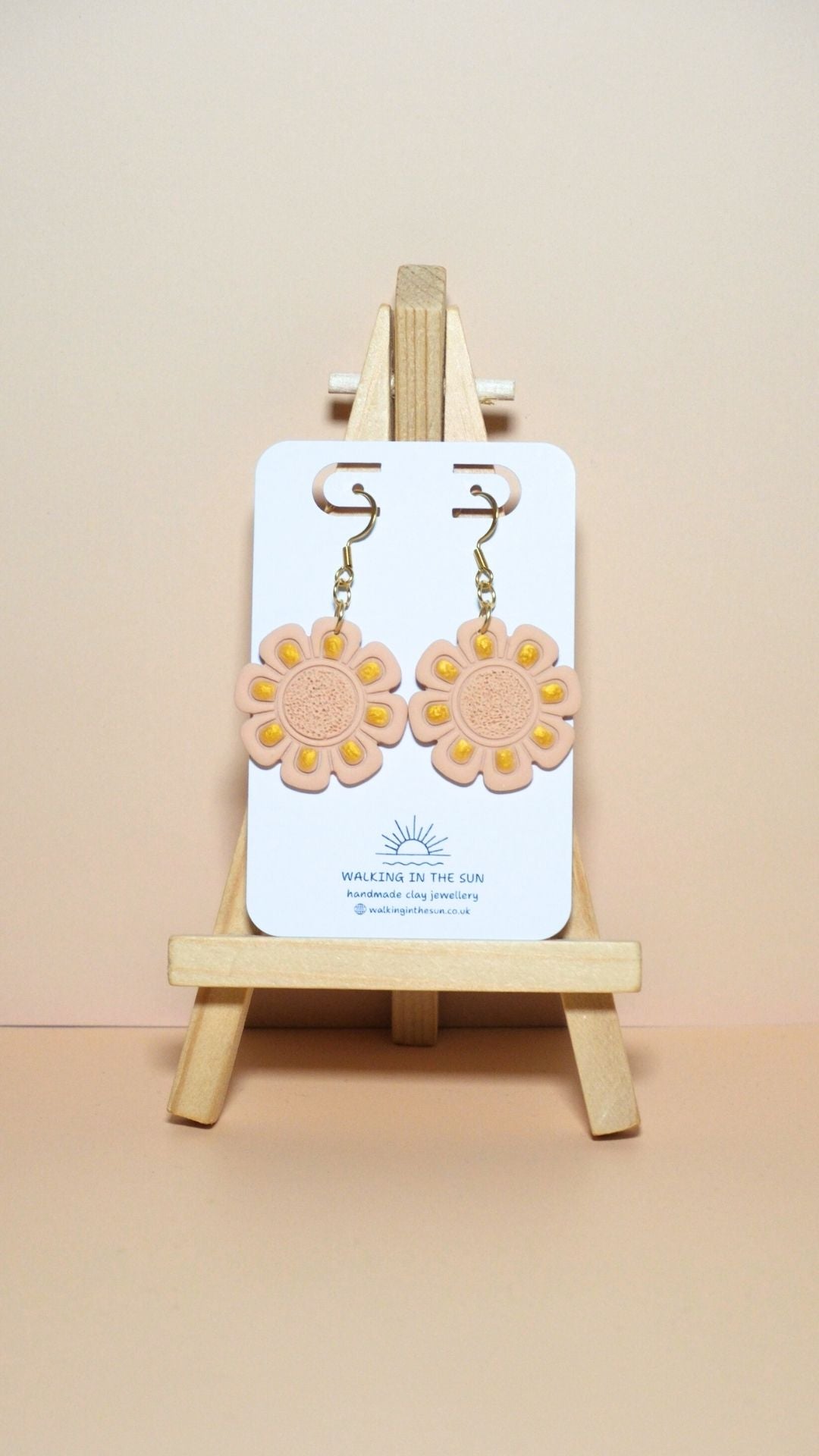 Handmade flower with gold detailing polymer clay earrings in sandy beige
