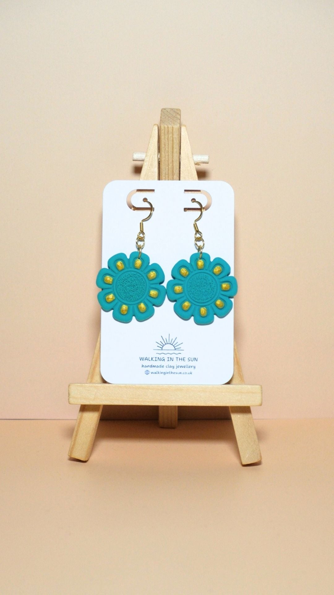 Handmade flower with gold detailing polymer clay earrings in sea blue