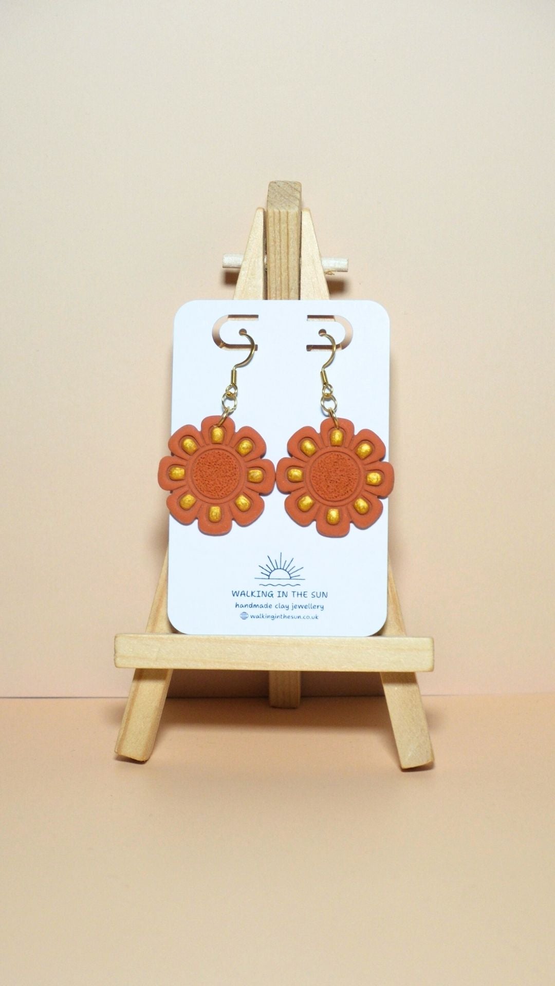 Handmade flower with gold detailing polymer clay earrings in sunny orange