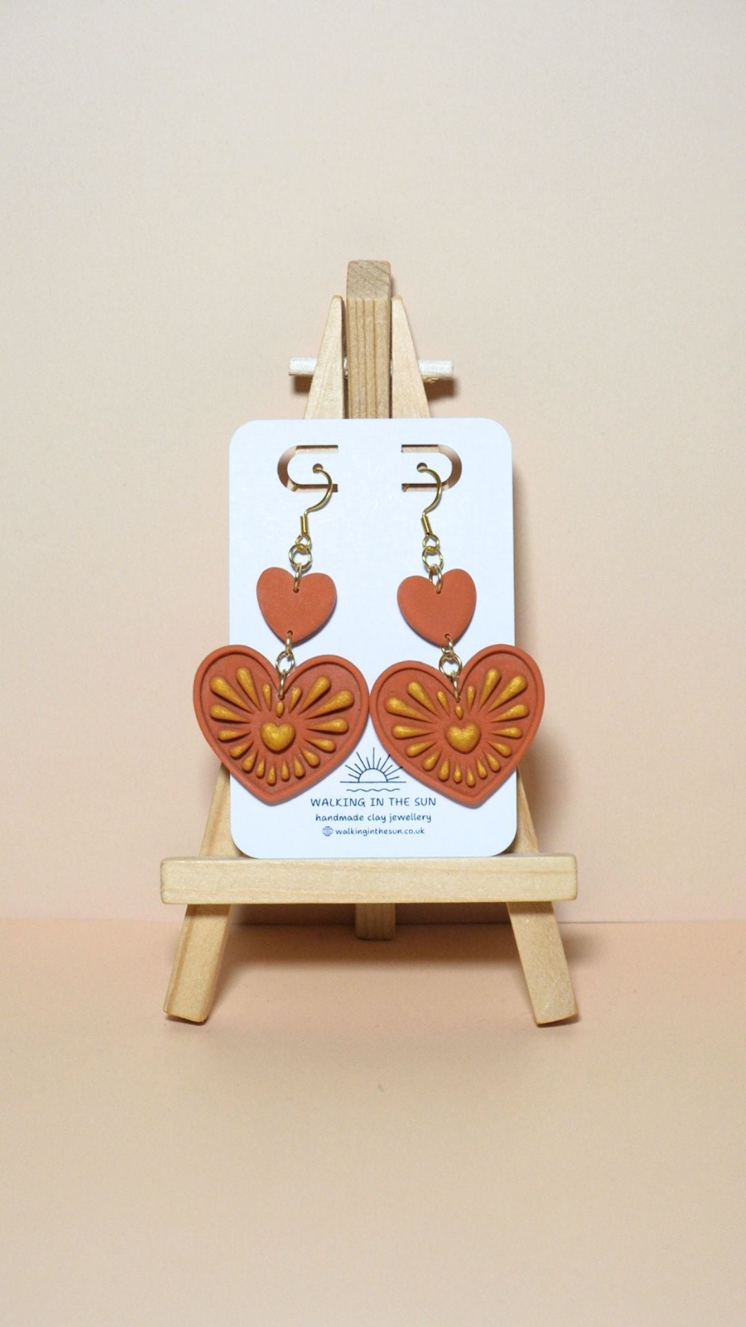 Handmade heart with gold detailing polymer clay earrings in sunny orange