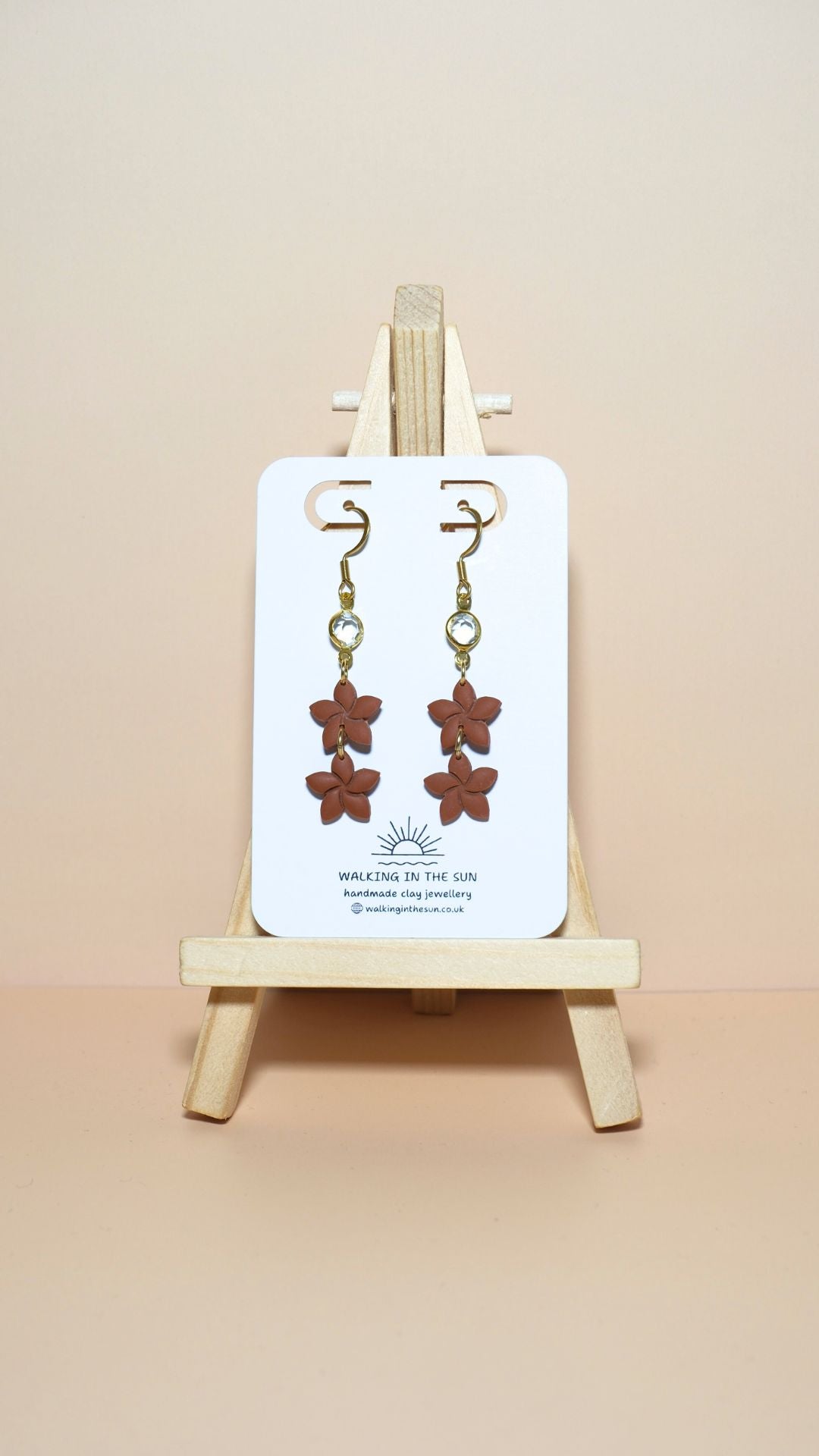 Handmade statement flower stack with gem polymer clay earrings in burnt orange